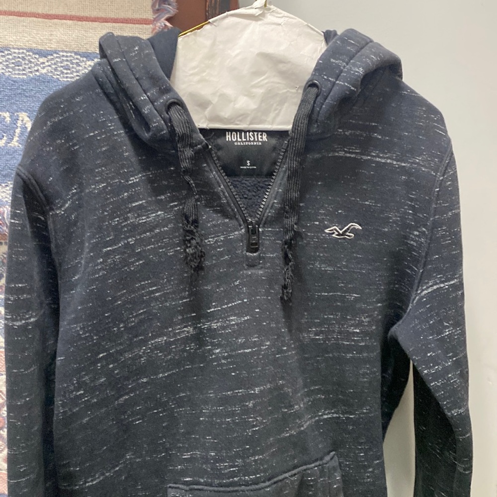 Grey and black Hollister hoodie.